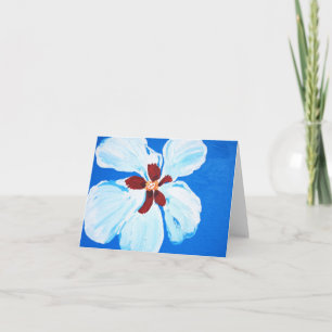 Hibiscus hawaïen sur carte bleue