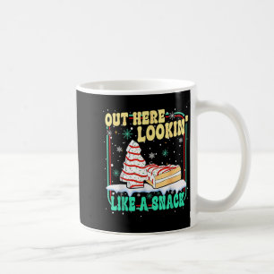 Hier draußen sehe ich wie ein Snack-Weihnachtskuch Kaffeetasse