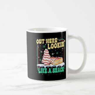 Hier draußen sehe ich wie ein Snack-Weihnachtskuch Kaffeetasse