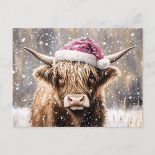 Highland-Kuh im Schnee mit Weihnachtsmannmütze Postkarte