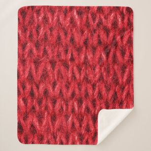 Hintergrund aus roter Strickwolle. Sherpadecke
