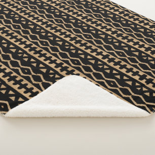 Hinzufügen von Flair mit Motiven für Tribal-Muds Sherpadecke