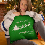 Ho Ho Ho Merry Christmas with Santa, Green Kissen<br><div class="desc">Add a fun seasonal touch to your home with this custom green and white throw pillow. Throw pillow features green background with white Merry Christmas greeting and Ho Ho Ho text, your family last name, and Santa Claus flying in his sleigh with reindeer. This throw pillow also makes a great...</div>