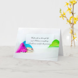 Hochzeitsringe auf Regenbogenblättern Karte