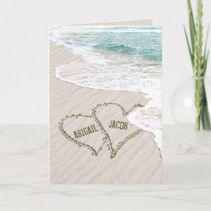 Hochzeitstrände im Sand mit Surf und Namen Karte