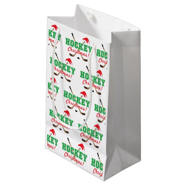 Hockey-Weihnachtsstöcke und -Weihnachtsmannmütze Kleine Geschenktüte (Vorderseite Schrägansicht)