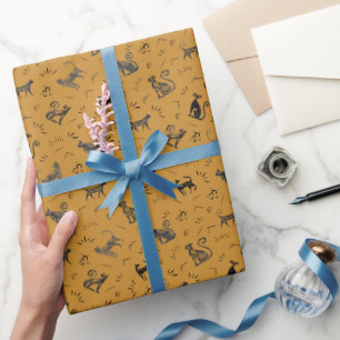 Höhlenkunstkatzen auf Orange Geschenkpapier
