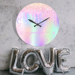 Holographic unicorn glitter drip rainbow monogram große wanduhr<br><div class="desc">A trendy holographic background with unicorn and rainbow pastel colors in pink, purple, rose gold, mint green. Decorated with faux glitter drips in rose gold, pink and purple. Personalize and add a name, written with a modern hand lettered style script with swashes. Purple colored letters. To keep the swashes only...</div>