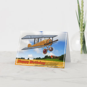 Hölzerner Doppeldecker über Feld-alles Gute zum Karte