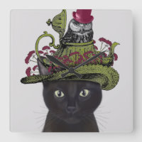 Chat noir avec théière et hibou
