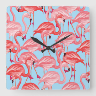 Horloge Carrée Flamants roses roses lumineux sur le bleu