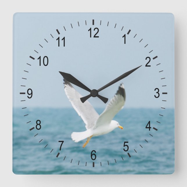 Horloge Carrée Goéland volant au-dessus de la mer (Recto)
