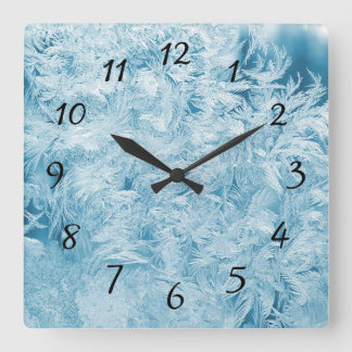 Horloge Carrée Plumes Abstraites et flocons de neige