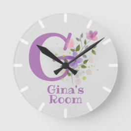 Horloge dans un design floral avec nom et initiale