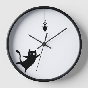 Horloge murale chat noir attrape un poisson