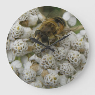 Horloge murale des abeilles à miel et des fleurs