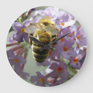 Horloge murale des fleurs d'abeilles et de bouddle