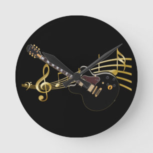 Horloge murale noire de score de guitare et de
