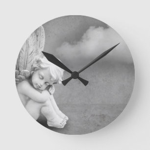 Horloge Ronde Ange couché sur gris arrière - plan, art angéli