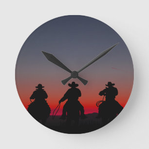 Horloge Ronde cowboy au coucher du soleil