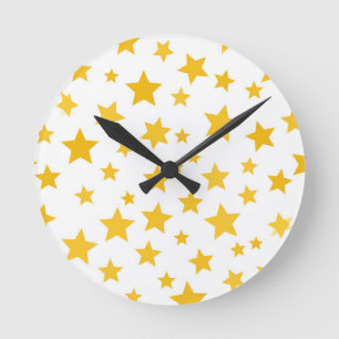 Horloge Ronde étoiles dorées sur fond blanc