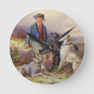 Horloge Ronde Garçon écossais avec des chiens-loup dans un