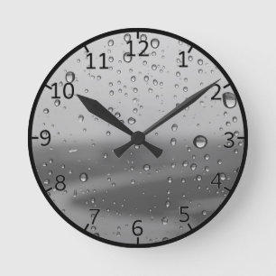 Horloge Ronde Gouttes de pluie sur fond argenté