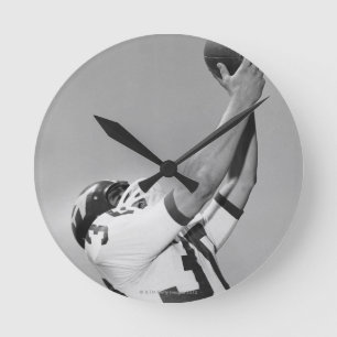 Horloge Ronde Homme jouant au football