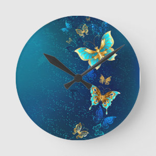 Horloge Ronde Papillons d'or sur un Arrière - plan bleu