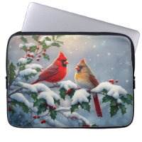 Cardinaux rouges et houx dans la neige