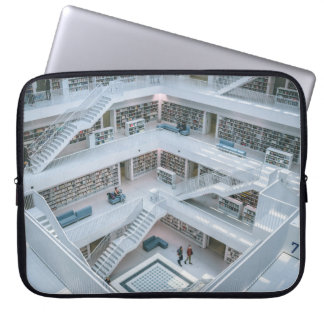 HOUSSE POUR ORDINATEUR PORTABLE PERSONNES MARCHANT À L'INTÉRIEUR DE LA BIBLIOTHÈQU