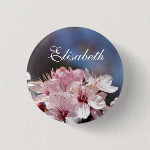 hübsche Frühlings rosa Kirschblüte im blauen Himme Button