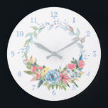 Hübsche Pastagerichte Wasserfarben Blumenreste Große Wanduhr<br><div class="desc">Feiner,  grüner Kranz mit pastellrosa,  blauen und gelben Blumen. Hintergrundfarbe und Zahlen können bearbeitet werden.</div>