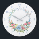 Hübsche Pastagerichte Wasserfarben Blumenreste Große Wanduhr<br><div class="desc">Feiner,  grüner Kranz mit pastellrosa,  blauen und gelben Blumen. Hintergrundfarbe und Zahlen können bearbeitet werden.</div>