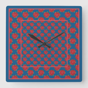 Hübsche Uhr an der Wand: Rote Rosen auf blau