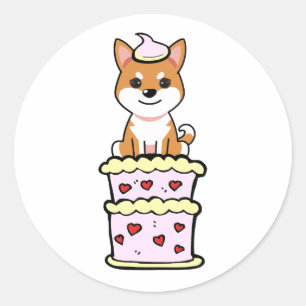 Hübscher Orangenhund springt aus einem Kuchen Runder Aufkleber