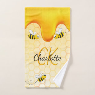 Hummelbienen, Honigwabenhonig, das ein Monogramm t Handtuch