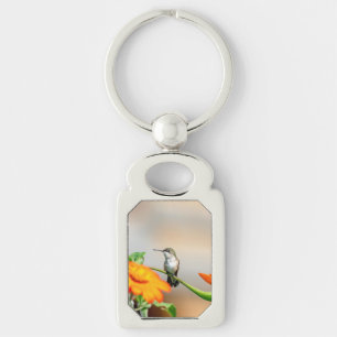 Hummingbird auf einer blühenden Pflanze Schlüsselanhänger