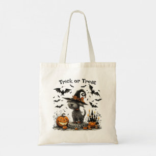 Hund in einem Hexenhutsieg-Trick oder Treat Tragetasche