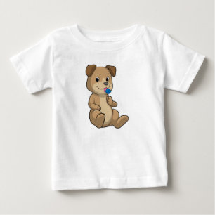 Hund mit Süßigkeiten Lutscher Baby T-shirt