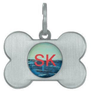Hundemarke an der Küste mit originaler Strandkunst Tiermarke