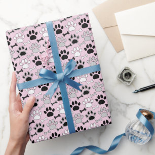 Hundepfotenabdrücke und Knochen Muster Rosa Geschenkpapier