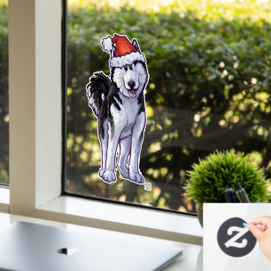 Husky in einer Weihnachtsmannmütze Fensteraufkleber