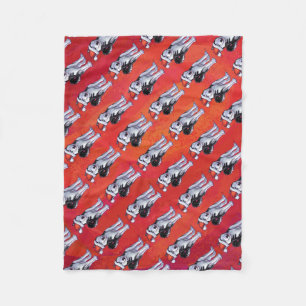 Husky in Weihnachtsmannmütze auf Rot Fleecedecke