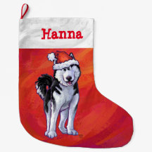 Husky in Weihnachtsmannmütze auf Rot