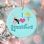 I Liebe Gymnastik Keramik Ornament<br><div class="desc">Ich Liebe Gymnastik. Ein hübsches Gymnastikgeschenk mit bezauberndem aquamarinem Text zwischen zwei niedlichen, schwindelnden kleinen Mädchen und einem schönen rosa Herz. Ein niedliches Gymnastikgeschenk für Kinder oder Damen. Ein brünett in einer Handablage und ein blondes Mädchen mit ausgestreckten Armen.</div>