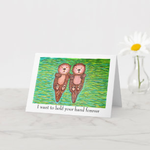 Ich liebe dich Karte mit zwei Ottern, die Händchen