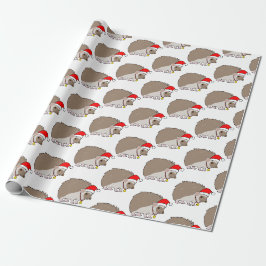 Igel zu Weihnachten in einer Weihnachtsmannmütze   Geschenkpapier