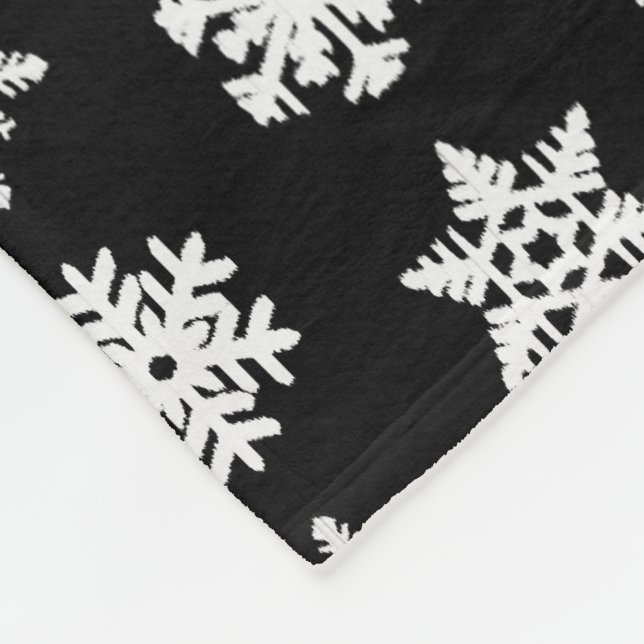 Ikat-Schneeflocken - Schwarzweiß Fleecedecke (Ecke)