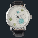 Ikonische Atomuhr-Sternexplosion Armbanduhr<br><div class="desc">Dieses Muster der atomaren Sternexplosion der Ikonen zeigt die ikonischen atomaren Sternexplosionen. Das ist richtig! Die alte Schule, der cremefarbene Hintergrund mit goldenen Fesseln ist der perfekte Hintergrund für die lebendigen türkisfarbenen, sanften Sellerie und die kitschigen Birnen grünen Kreise. Die Farbflecken sind sporadisch in verschiedenen Größen platziert, mit überlegenen schwarz-V-förmigen...</div>